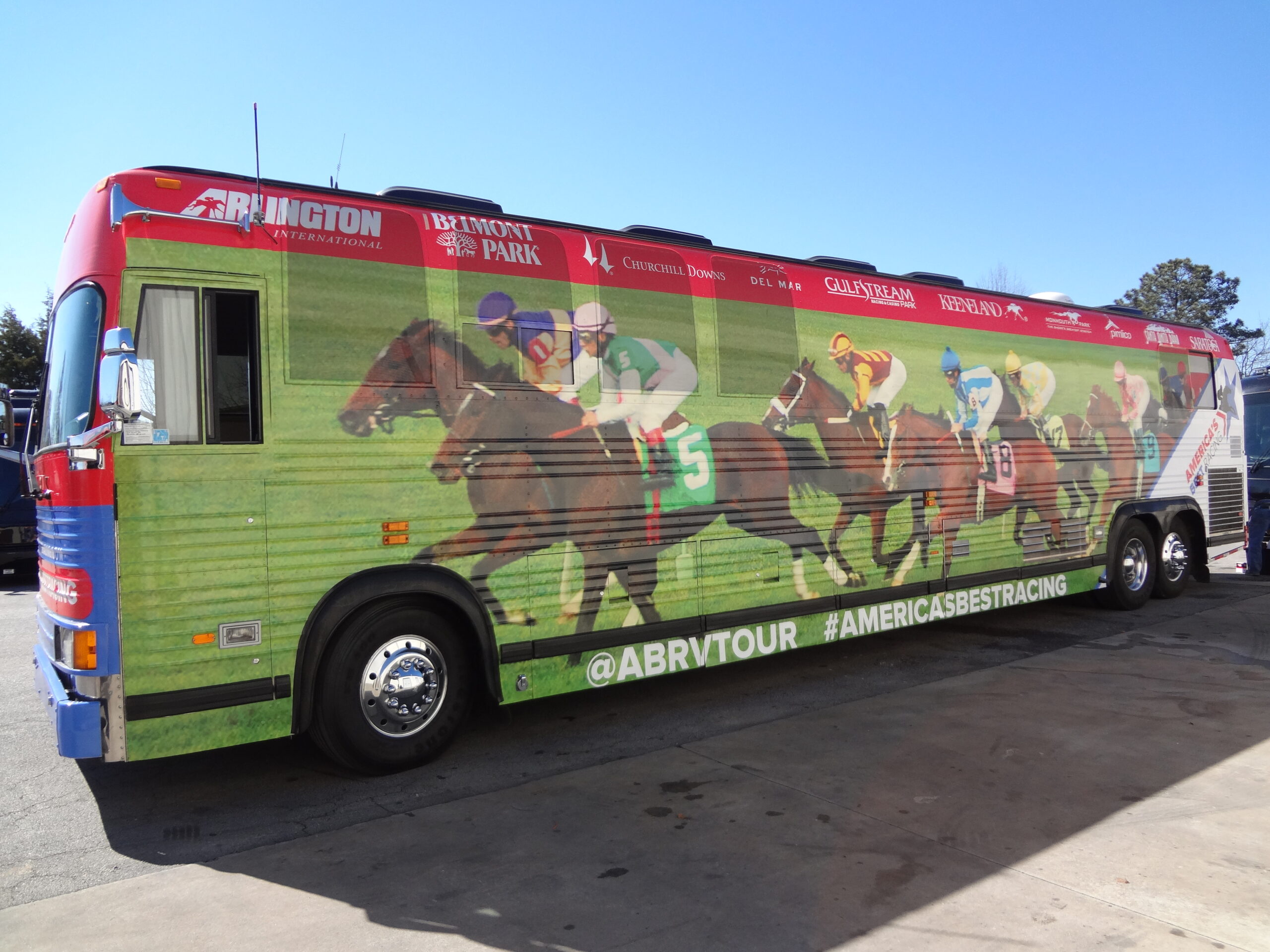 This is a strong example of the utilization of the custom coach wrap tours and event medium with this well outfitted sleeper for this long term multi event tour.