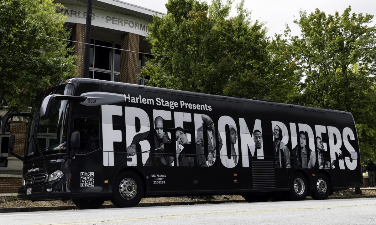 Bus Wrap Inc. full coach wrap for Harlem Stage East Coast tour with bold promotional branding